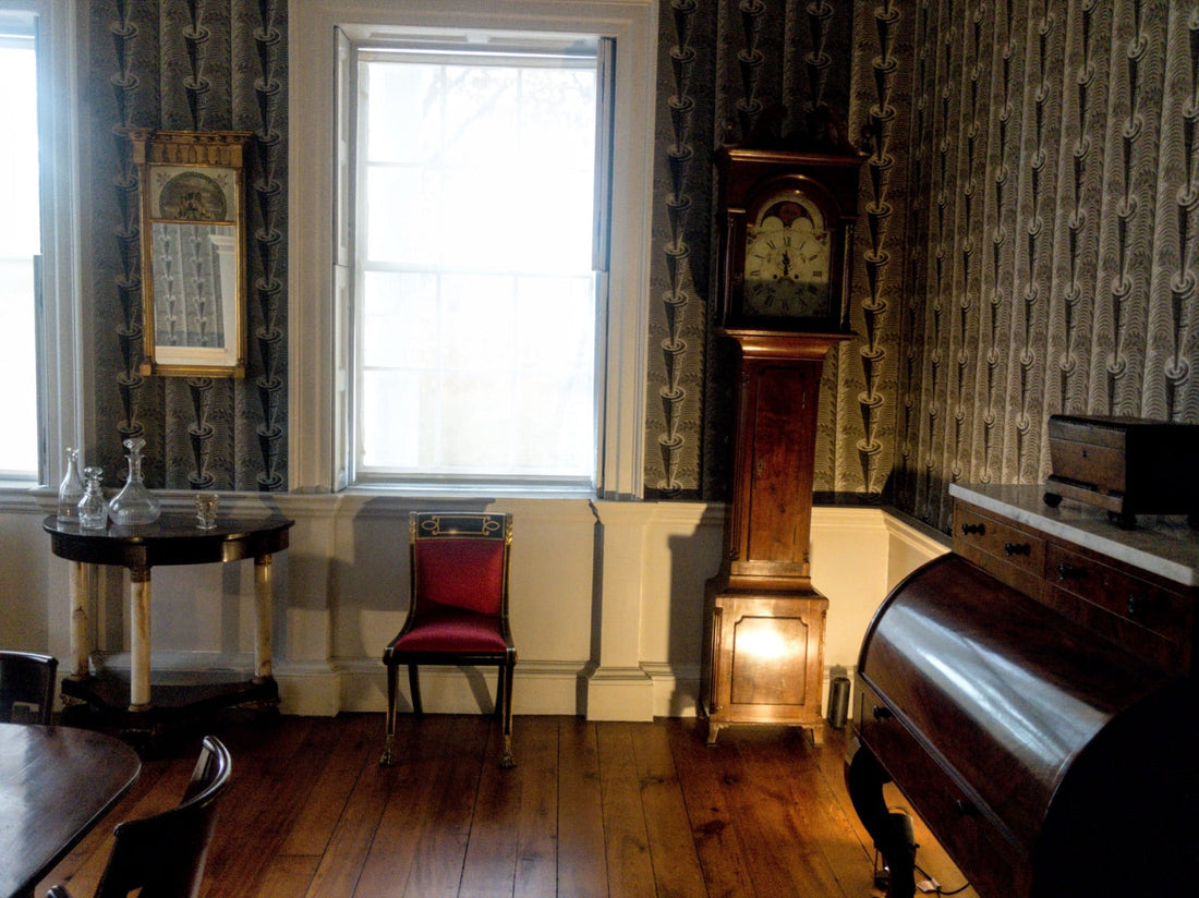 Chiming clock in an old living room, parquet and window