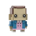Buildable big-head figure Stranger Things Eleven in a pink dress